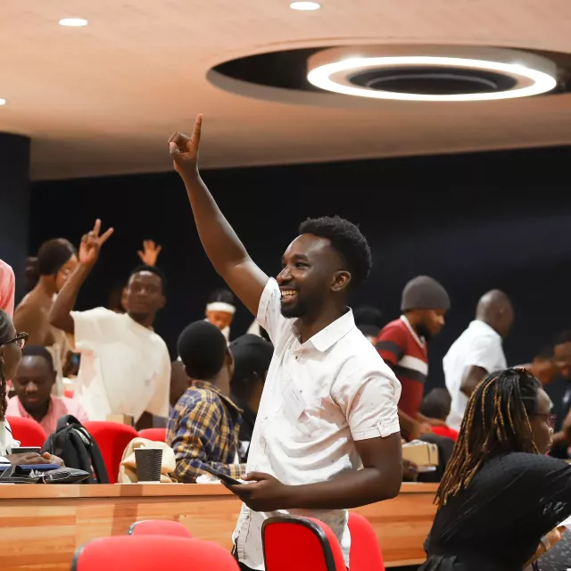 People celebrating in a lecture theatre