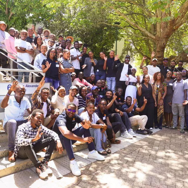 Large group of people gathered on the steps of a building
