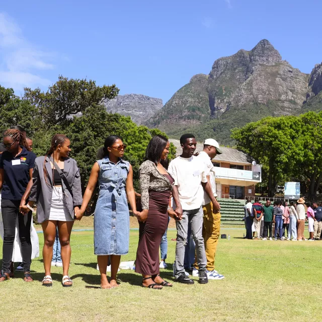 Group of people with a view of Table Mountain in the background