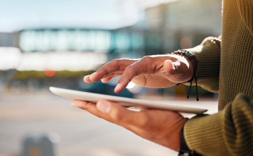 Person browsing the internet on tablet. Stock image